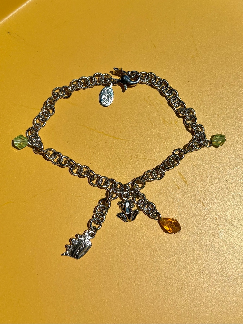 Kirks Folly Silver-Tone Charm Bracelet with Green and Amber Drops